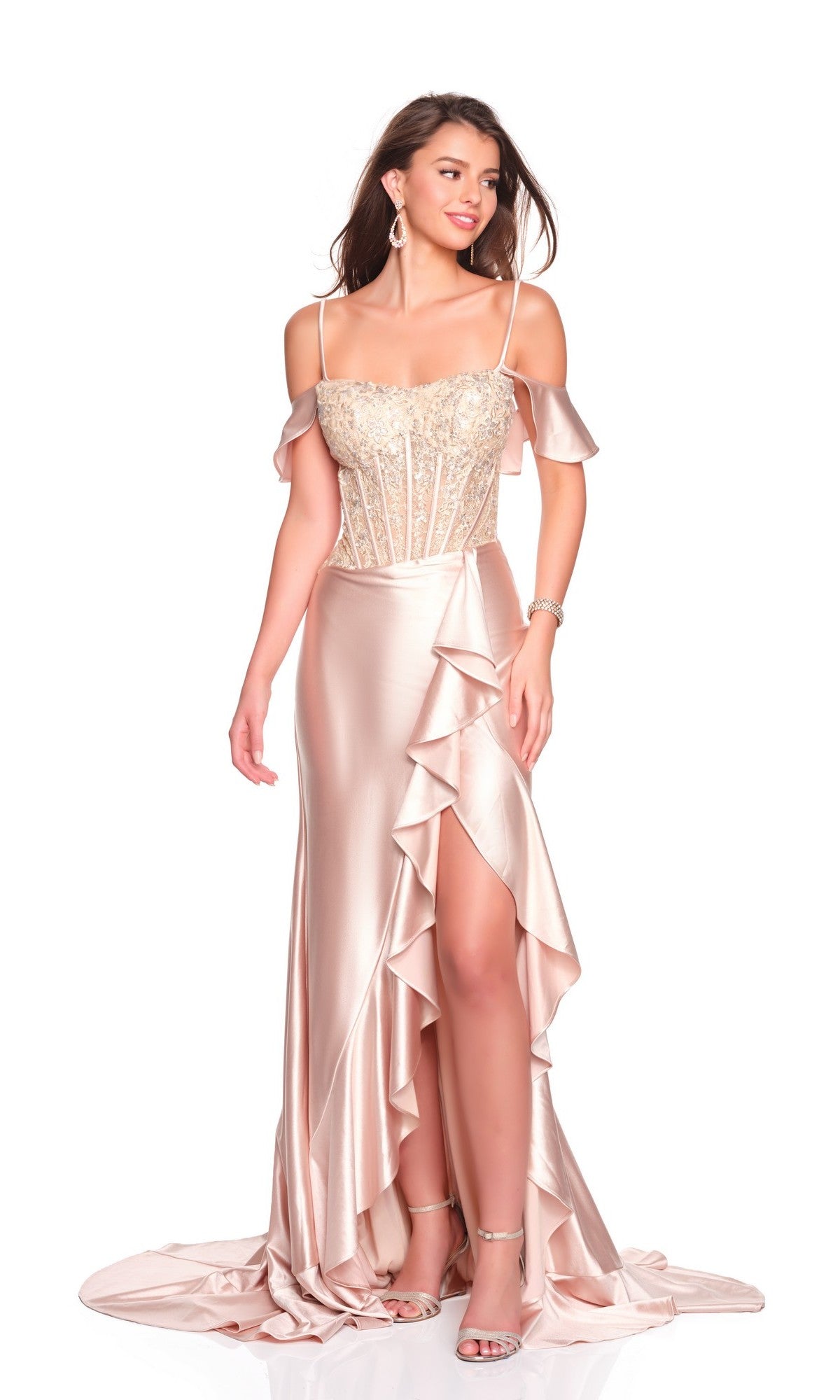 A woman poses against a white background in the Dave and Johnny 12718 long prom dress—light pink, off-the-shoulder satin with a fitted embellished bodice, ruffled slit skirt, and elegant train.